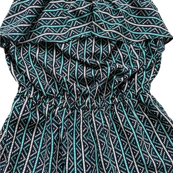 Strapless multi-color romper with ruffle bust line and pompom fringe on shorts. - Picture 2 of 3